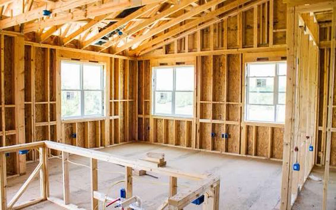 Open wood framing inside a house before drywall